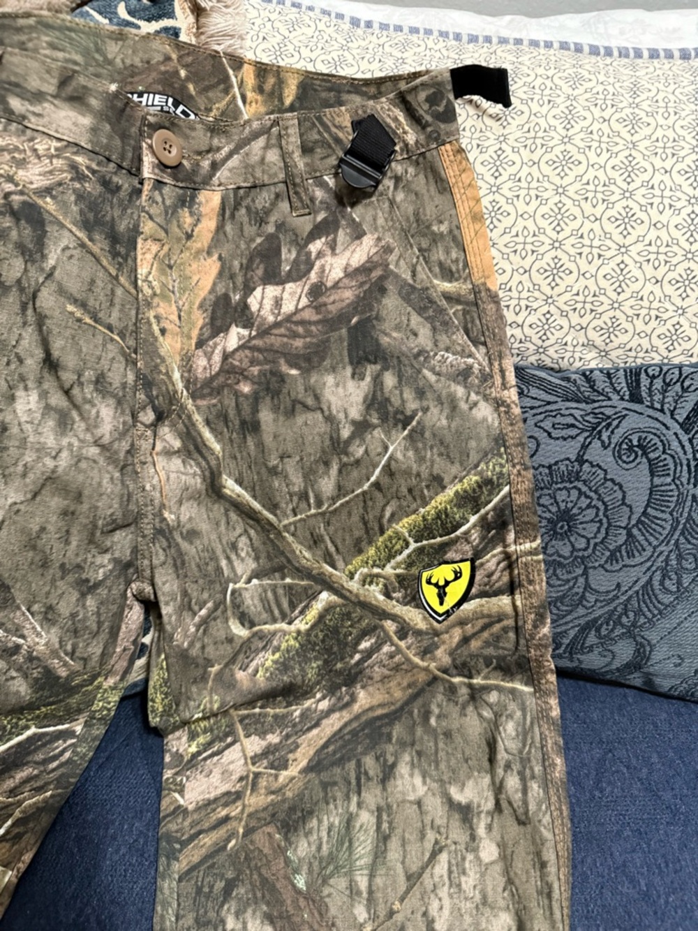 Mossy Oak Camouflage Hunting Pants with Yellow Shield Emblem